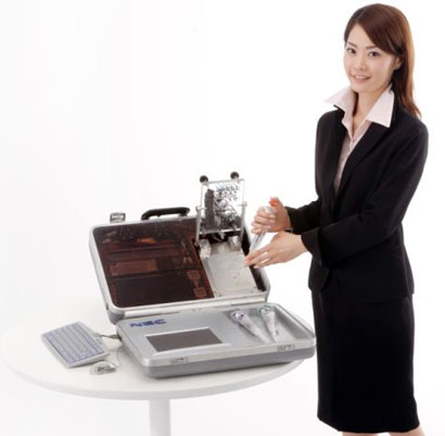 nec-portable-dna-tester-and-lady.jpg